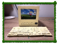a cardboard sculpture of a computer with kinito